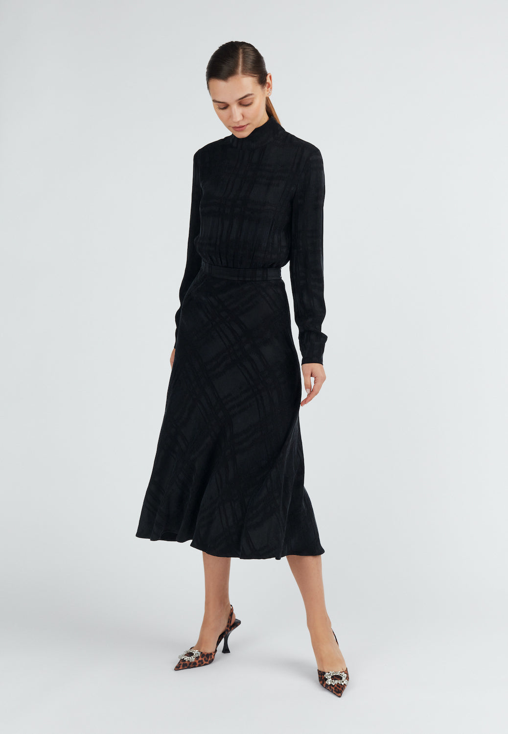 Black open back turtleneck dress with round skirt